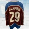 Fan Cave Sports Nathan MacKinnon Colorado Avalanche Autographed Burgundy Fanatics Jersey W/ "2014 Calder" Inscription - JSA Autographed Memorabilia